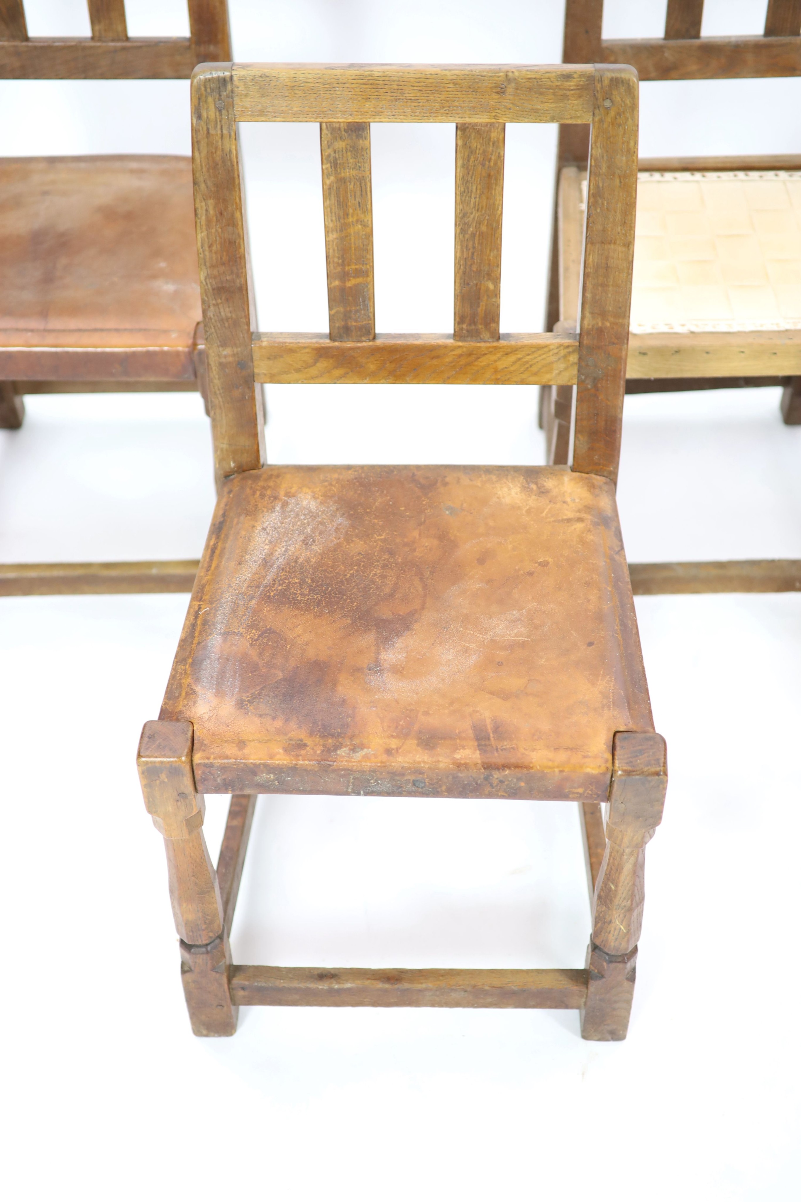 A set of six Robert Thompson 'Mouseman' oak dining chairs